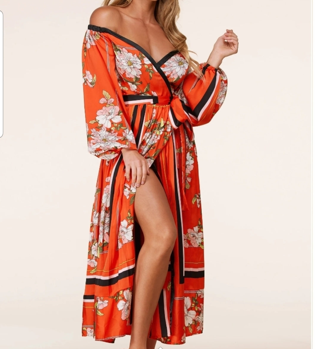 A Vibrant orange maxi dress in a beautiful flower print