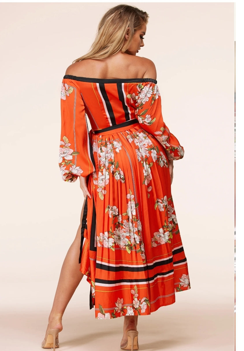 A Vibrant orange maxi dress in a beautiful flower print